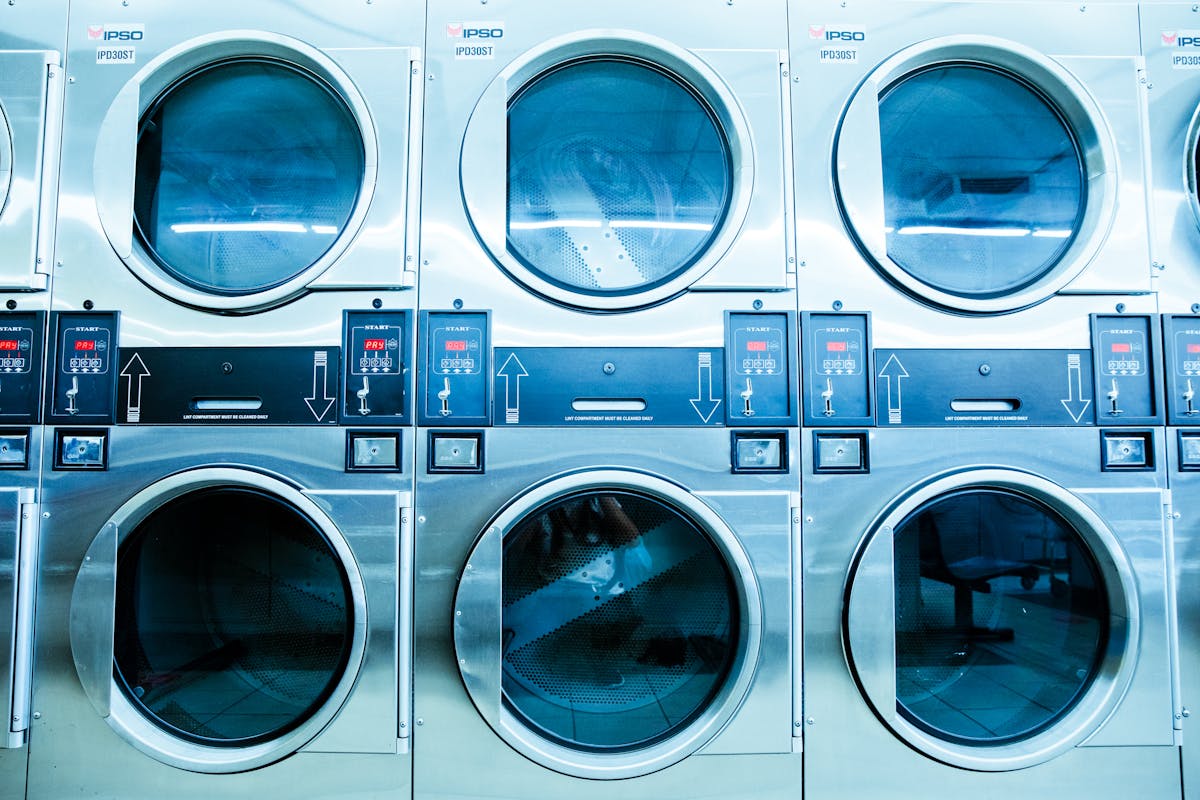 A bank of clean self-service washers and dryers at The Laundry Room in Roxboro, NC