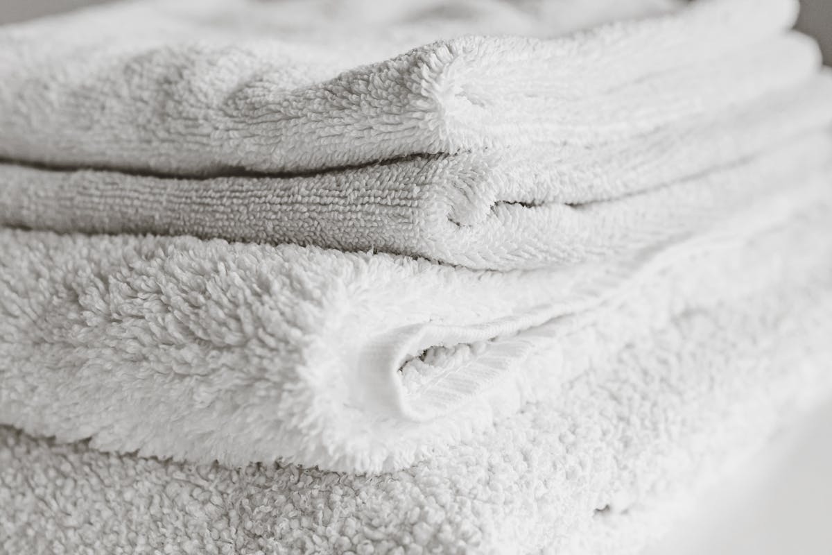 A neat stack of freshly washed and folded towels